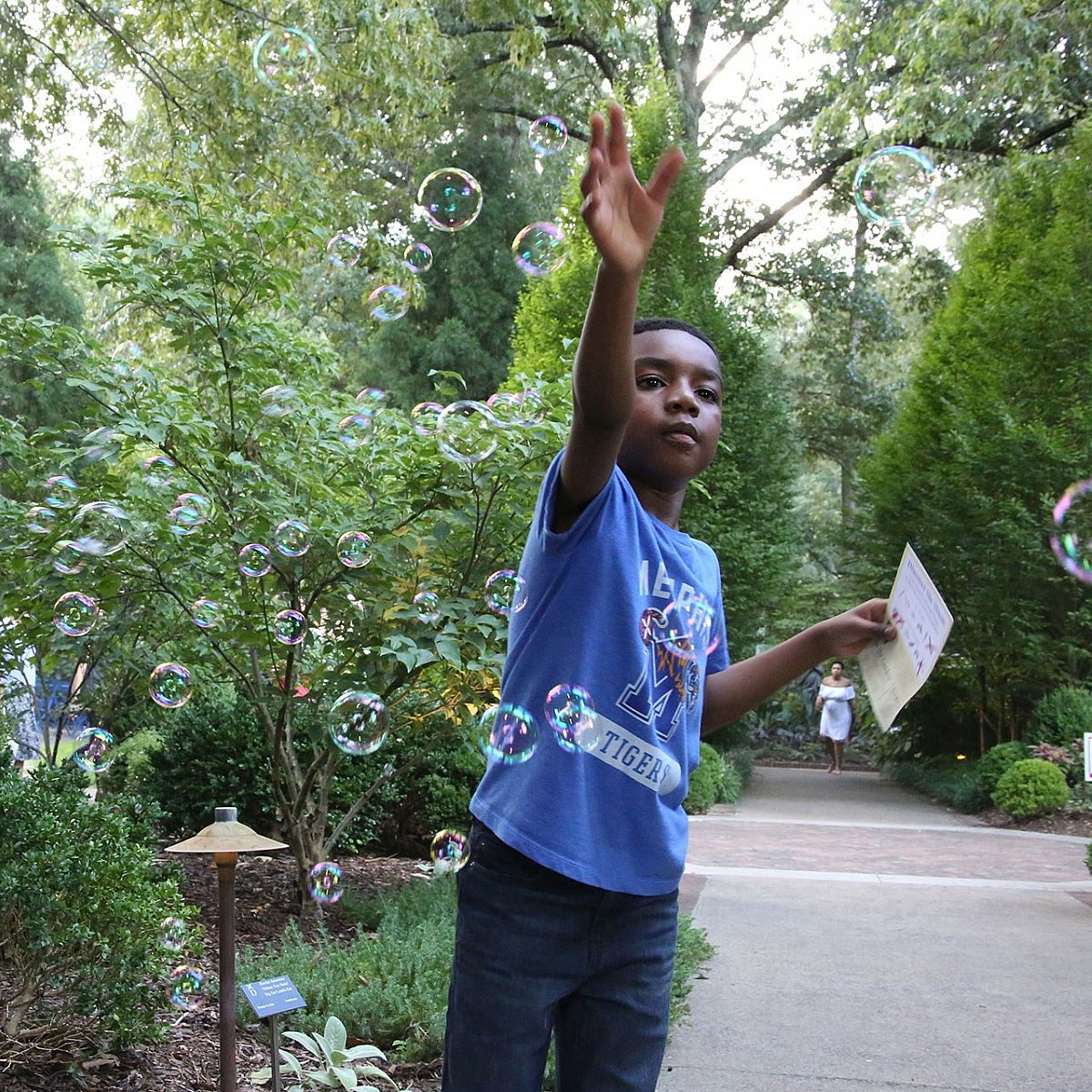 Small boy blowing bubbles the Dixon